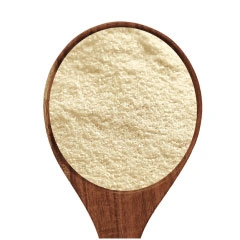  A spoonful of potato flour on a white background .